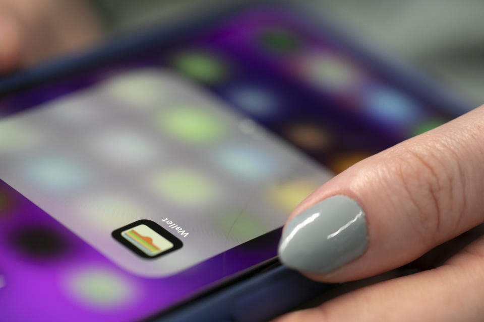 This Tuesday, Oct. 8, 2019, photo shows the Apple Pay app on an iPhone in New York. Experts warn that digital wallet services like Apple Cash and Venmo are prime targets for scammers. (AP Photo/Jenny Kane)