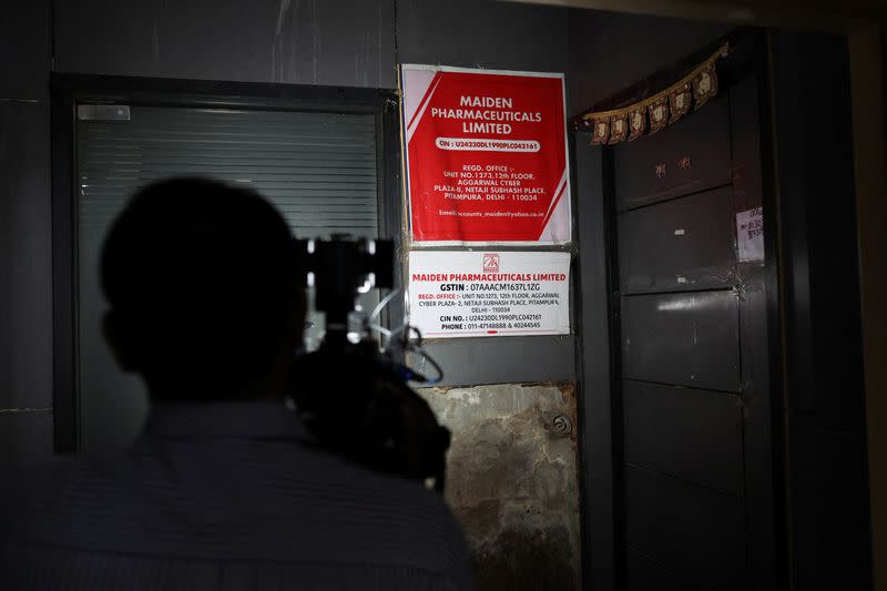 A cameraman takes visuals outside the office of Maiden Pharmaceuticals Ltd. company, in New Delhi