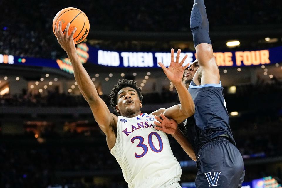 Kansas guard Ochai Agbaji (30) is happy to play whatever position Cavaliers coach J.B. Bickerstaff needs him to play. [David J. Phillip/Associated Press]