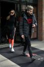 Mixing Athleisure with luxury, Gigi steps out wearing New Balance tights, Adidas sneakers and Yves Saint Laurent purse while Zayn donned a Billionaire Boys Club sweatshirt and grey suede shoes, as they checked out of their hotel in NYC. <br><br> Credit: Splash