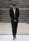 K-pop singer Jung Joon-young arrives to attend a hearing at the Seoul Central District Court in Seoul, South Korea, Thursday, March 21, 2019. A South Korean pop star has appeared at a court hearing to decide whether to arrest him over allegations that he illegally shared sexually explicit videos of women taken without their knowledge or consent in online group chats. (AP Photo/Lee Jin-man)