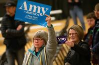 Disapointed supporters hold signs as they face off with protestors who took over the stage forcing Democratic presidential hopeful Minnesota Senator Amy Klobuchar to cancel her rally before it even started on March 1, 2020 in St. Louis Park, west of Minneapolis, Minnesota. - Hundreds of Klobuchar supporters witnessed a group of Black Lives Matter protesters demanding her to drop out of the race after her misshandling of Myon Burrell's case in 2002 when she was County Attorney. (Photo by Kerem Yucel / AFP) (Photo by KEREM YUCEL/AFP via Getty Images)