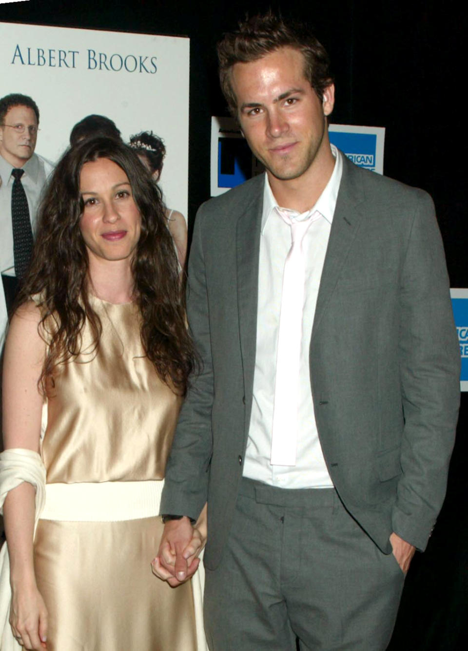 <p>Reynolds brought then-girlfriend Alanis Morissette to the premiere of comedy remake<em>.</em> The pair were together for five years before separating in 2007. (Photo: Gregory Pace/FilmMagic) </p>