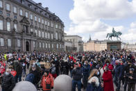 People attend a demonstration against the tightening of Denmark’s migration policy and the deportation orders in Copenhagen, Denmark, Wednesday, April 21, 2021. Ten years after the start of the Syrian civil war, Denmark has become the first European country to start revoking the residency permits of some refugees from the Damascus area. (AP Photo/David Keyton)