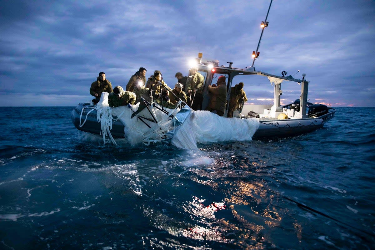 US Navy sailors recover a shot-down Chinese surveillance balloon from the Atlantic Ocean on 6 February. (US NAVY/AFP via Getty Images)