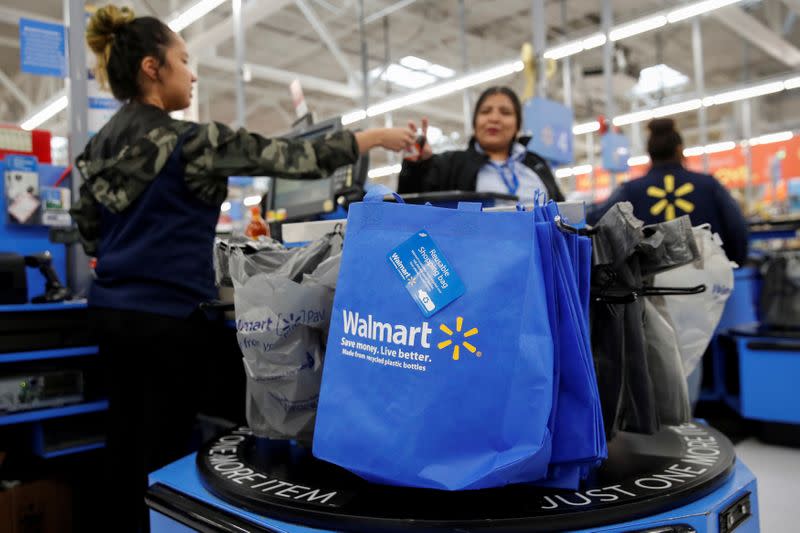 FILE PHOTO: A customer pays for her groceries at a Walmart store ahead of the Thanksgiving holiday in Chicago