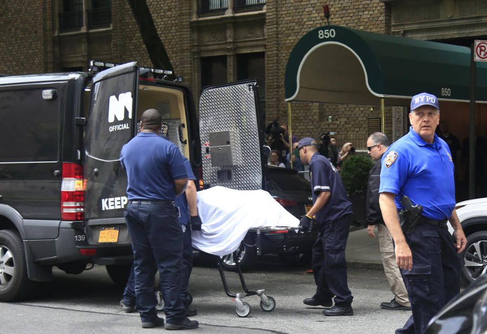 The body of fashion designer Kate Spade is removed from her Park Avenue apartment. Source: AP