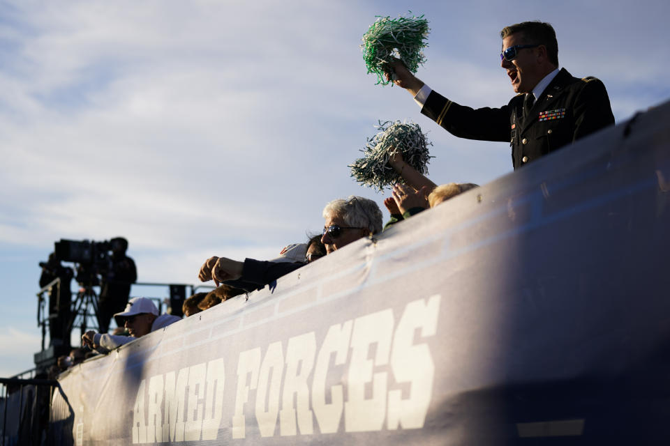 A fan cheers during the first half of the Carrier Classic NCAA college basketball game between Gonzaga and Michigan State aboard the USS Abraham Lincoln in Coronado, Calif. Friday, Nov. 11, 2022. (AP Photo/Ashley Landis)