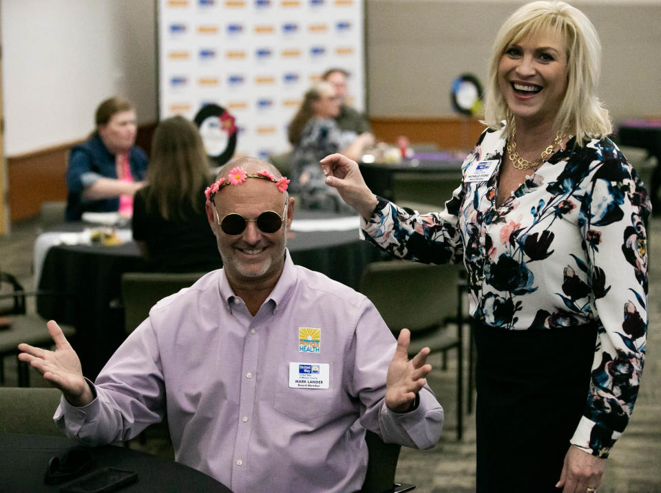 Florida Department of Health in Marion County Administrator Mark Lander was a good sport after Marion County Commissioner Michelle Stone made him dress up as a flower child, since United Way of Marion County was started in the 1960s. UWMC held a Community Celebration Thursday to highlight its programs, give awards and announce fundraising results.