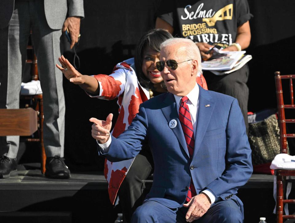 President Joe Biden and US Rep. Terri Sewell, D-Ala., gesture before Biden's remarks to mark the 58th anniversary of Bloody Sunday, at the Edmund Pettus Bridge in Selma, Alabama, on March 5, 2023.