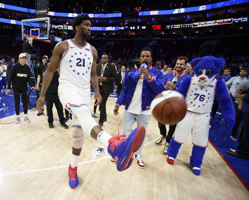 Philadelphia 76ers' Joel Embiid kicks the ball into the crowd following Game 3 of the team's second-round NBA basketball playoff series against the Toronto Raptors, Thursday, May 2, 2019, in Philadelphia. The 76ers won 116-95. (AP Photo/Chris Szagola)