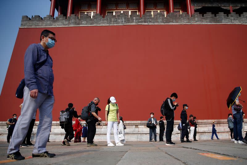 Visitors line up to enter the Forbidden City in Beijing