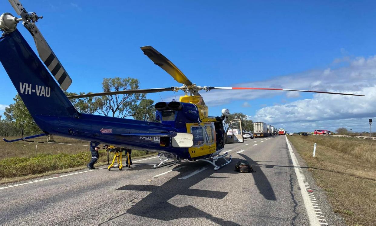 <span>A rescue helicopter at the scene of a fatal bus crash on the Bruce Highway near Gumlu in north Queensland.</span><span>Photograph: RACQ CQ Rescue</span>