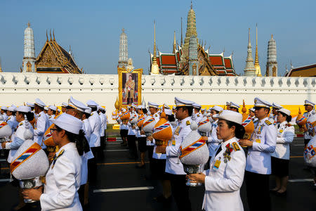 FILE PHOTO: Royal officials take part in a procession to deliver sacred water collected from all provinces in Thailand from Wat Suthat to the Grand Palace, to be consecrated for the upcoming coronation ceremony for Thailand's King Maha Vajiralongkorn, in Bangkok, Thailand, April 19, 2019. REUTERS/Athit Perawongmetha/File Photo