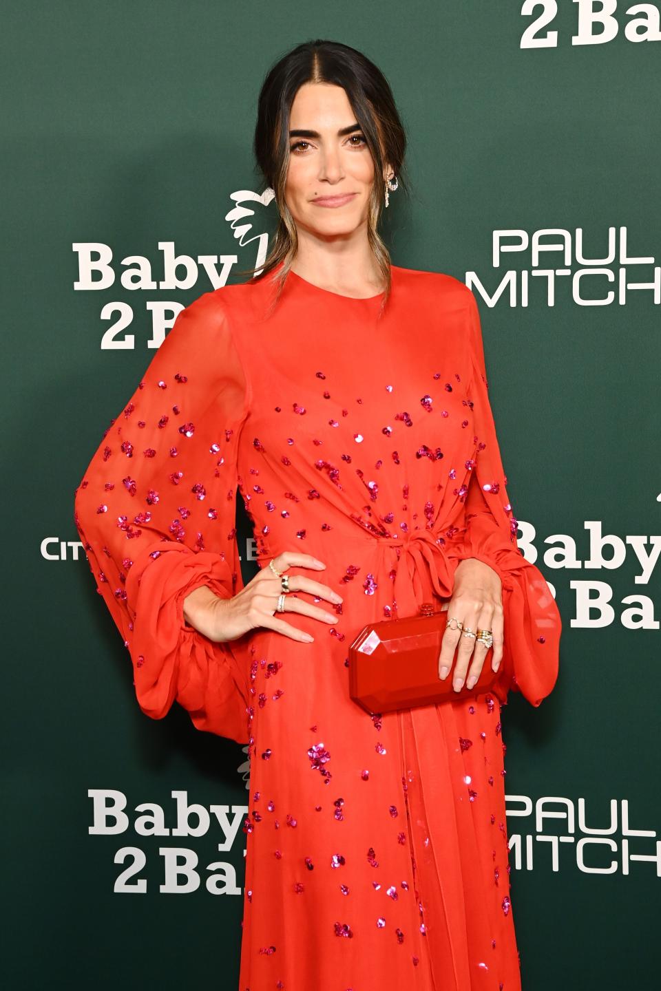 closeup of her in a gem covered dress for an event