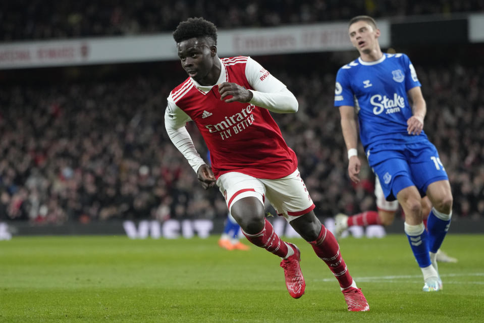 Arsenal's Bukayo Saka, centre, celebrates after scoring the opening goal during the English Premier League soccer match between Arsenal and Everton at the Emirates stadium in London, Wednesday, March 1, 2023. (AP Photo/Kirsty Wigglesworth)