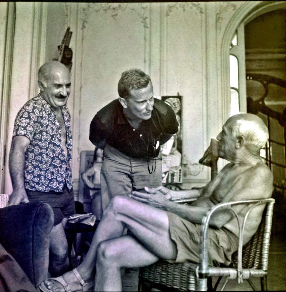 <div class="inline-image__caption"><p>Fred Baldwin (center) with Pablo Picasso, at the painter’s home in Cannes, July 1955.</p></div> <div class="inline-image__credit">All photographs are copyright Fred Baldwin from the book Dear Mr. Picasso: An Illustrated Love Affair with Freedom published by Schilt Publishing</div>