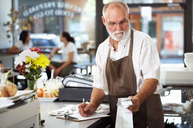 Store Clerk Checking Receipts