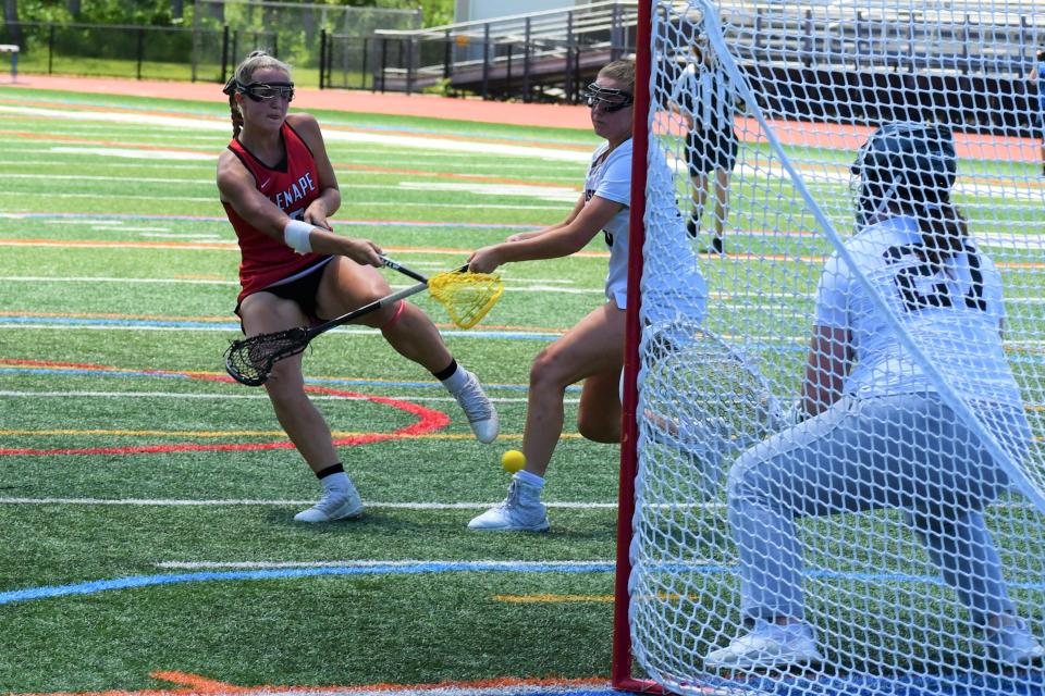 Lenape senior Gianna Monaco bounces a shot by Morristown junior goalie Olivia Licardi at the 2022 NJSIAA Group 4 girls lacrosse championship at Warren Hills High School