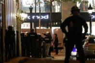 Police secure a side street as other conduct an investigation on the Champs Elysees Avenue after one policeman was killed and another wounded in a shooting incident in Paris, France, April 20, 2017. REUTERS/Christian Hartmann