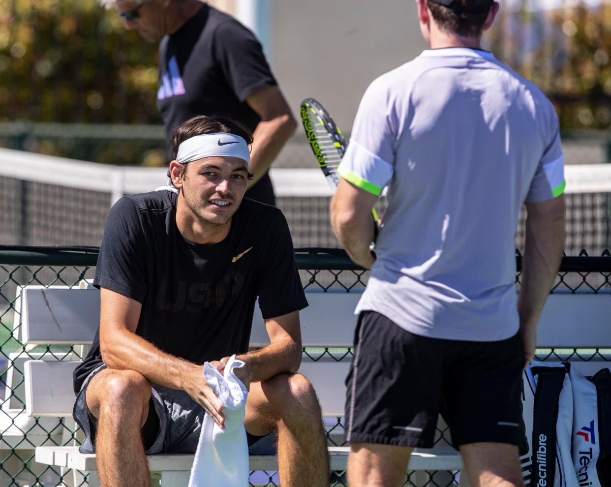 Taylor Fritz of the United States takes a rest during a practice session at the BNP Paribas Open at the Indian Wells Tennis Garden in Indian Wells, Calif., Thursday, March 9, 2023. 