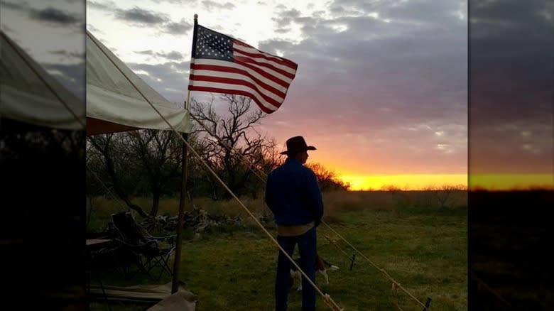 Kent Rollins silhouette with flag