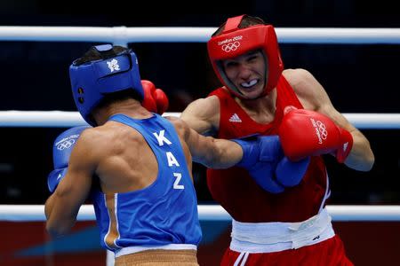 Russia's Andrey Zamkovoy (R) fights Kazakhstan's Serik Sapiyev during their Men's Welter (69kg) semi-final boxing match at the London Olympic Games August 10, 2012. REUTERS/Damir Sagolj