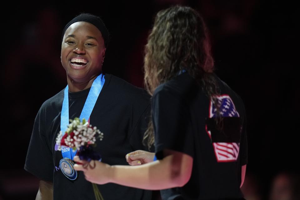 Simone Manuel and Abbey Weitzeil ccelebrate at the medal ceremony after the women's 50 freestyle during wave 2 of the U.S. Olympic Swim Trials on Sunday, June 20, 2021, in Omaha, Neb. (AP Photo/Jeff Roberson)