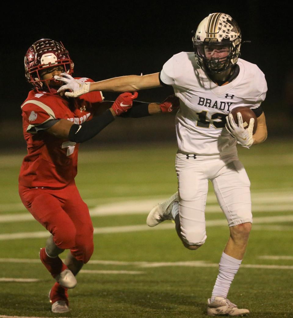 Brady High School's Keegan Farris stiff arms a Stanton player in a Class 3A area football playoff at Hawks Stadium in Wall on Friday, Nov. 19, 2021.