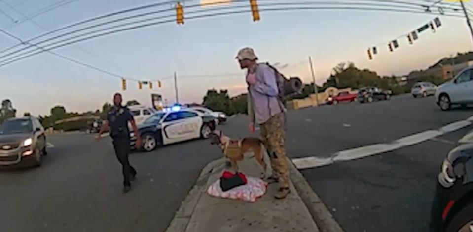 In this image from police video, Officer Maurice Taylor III arrives to assist Officer Cierra Brooks with homeless veteran Joshua Rohrer in Gastonia, N.C., on Oct. 13, 2021.