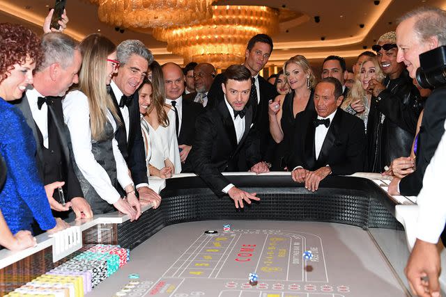 <p> Denise Truscello/Getty Images for Fontainebleau Las Vegas</p> Justin Timberlake rolls the first dice as Tom Brady, Fontainebleau Las Vegas COO Colleen Birch, Paul Anka, Cher, and Alexander "A.E." Edwards look on on Dec. 13, 2023