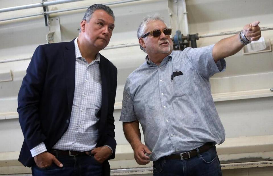 Sen. Alex Padilla listens to Richard Espinoza, plant manager at the Almond Aliance processing facility, during an Aug. 17, 2022 tour of the plant near Cantúa Creek.
