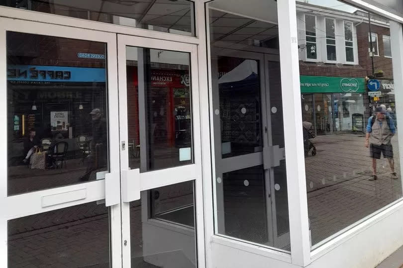 The empty inside of the shop on  Queens Road