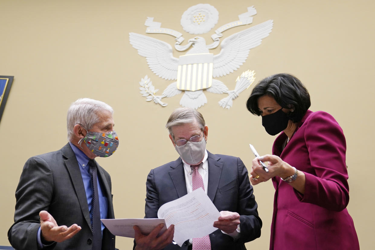 Dr. Anthony Fauci, the nation's top infectious disease expert, left, Department of Health and Human Services Chief Science Officer for COVID Response David Kessler, center, and Centers for Disease Control and Prevention Director Dr. Rochelle Walensky, right, talk before the start of a House Select Subcommittee hearing on Capitol Hill in Washington, Thursday, April 15, 2021, on the coronavirus crisis. (AP Photo/Susan Walsh, Pool)