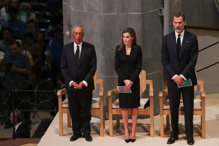 Portuguese president Marcelo Rebelo de Sousa and King Felipe of Spain with his wife Letizia are seen as High mass is celebrated in the Basilica of the Sagrada Familia in memory of the victims of the van attack at Las Ramblas in Barcelona earlier this week, Spain August 20, 2017. REUTERS/Sergio Perez