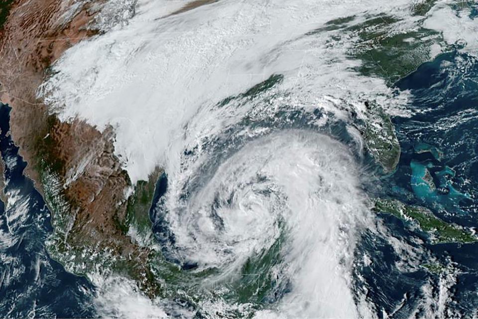 A NOAA satellite image shows Tropical Storm Zeta, which is expected to strengthen to a hurricane, in the Gulf of Mexico and approaching the coast of Louisiana on 27 October. (via REUTERS)