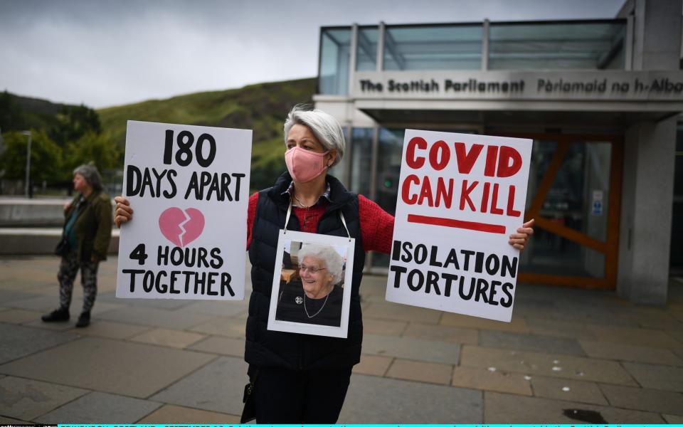 Relatives stage a demonstration over care home coronavirus visiting rules outside the Scottish Parliament on September 16, 2020  - Getty Images Europe