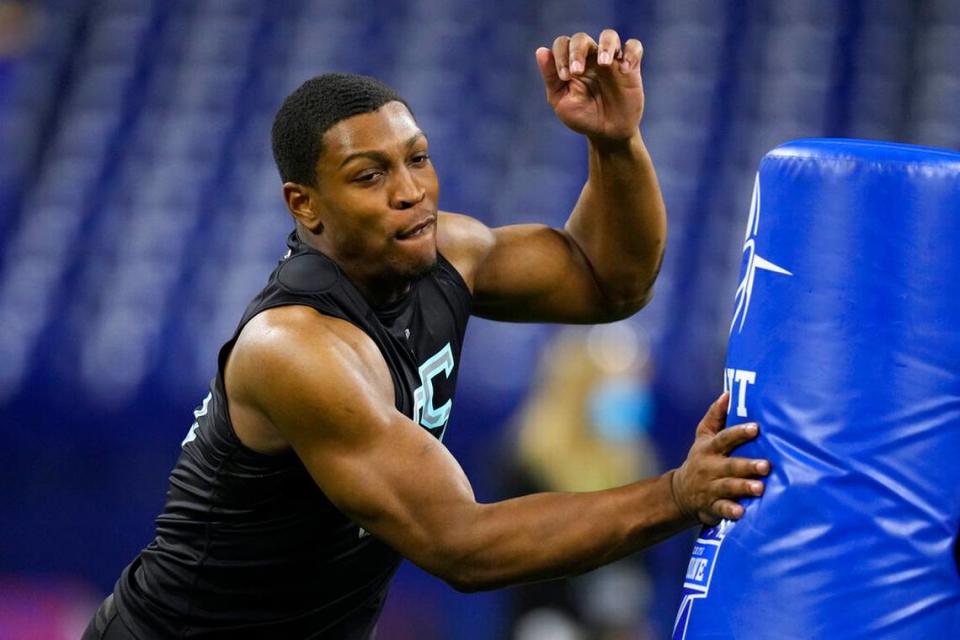 Georgia linebacker Channing Tindall runs a drill at the NFL football scouting combine, Saturday, March 5, 2022, in Indianapolis.