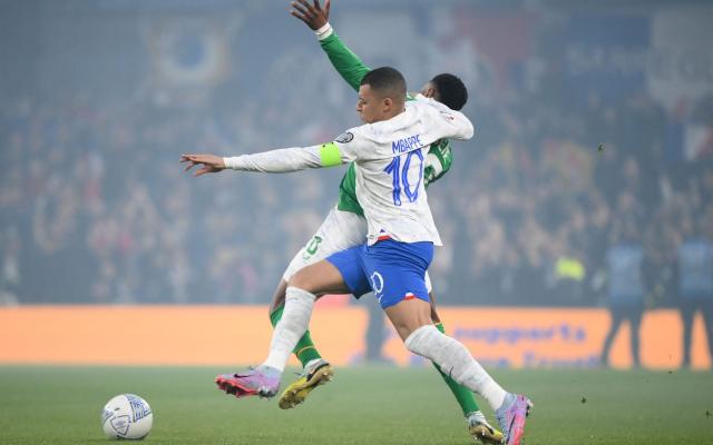 France's striker Kylian Mbappe vies with Republic of Ireland's midfielder Chiedozie Ogbene - AFP via Getty Images