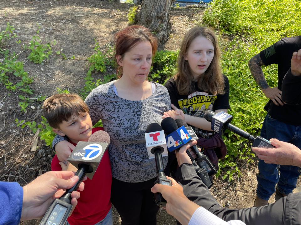 Kelly Welling, center, mother of Wesley Welling, 15, stands with children Cody and Hannah on Wednesday as she talks to reporters outside Westlake High School in Thousand Oaks.