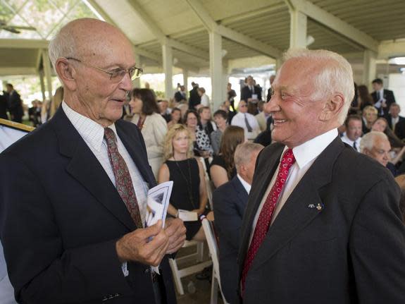 Apollo 11 Astronauts Michael Collins, left, and Buzz Aldrin talk at a private memorial service celebrating the life of Neil Armstrong, Aug. 31, 2012, at the Camargo Club in Cincinnati. Armstrong, the first man to walk on the moon during the 196