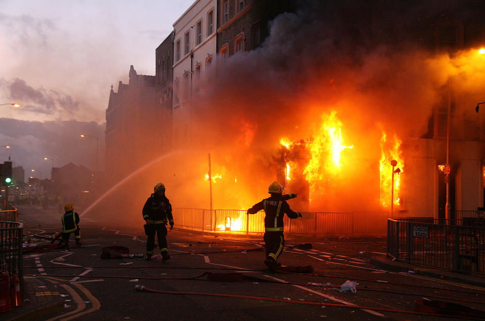 Firefighters attack a blaze at a pawnbrokers in Croydon on Monday.