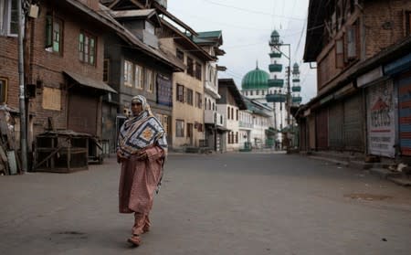 The Wider Image: Barricades and books in restive Kashmir neighbourhood