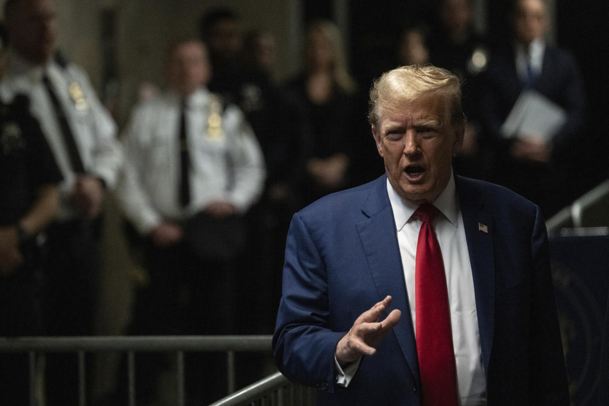 Former President Donald Trump addresses the media before another day of testimony in his trial at Manhattan criminal court in New York.