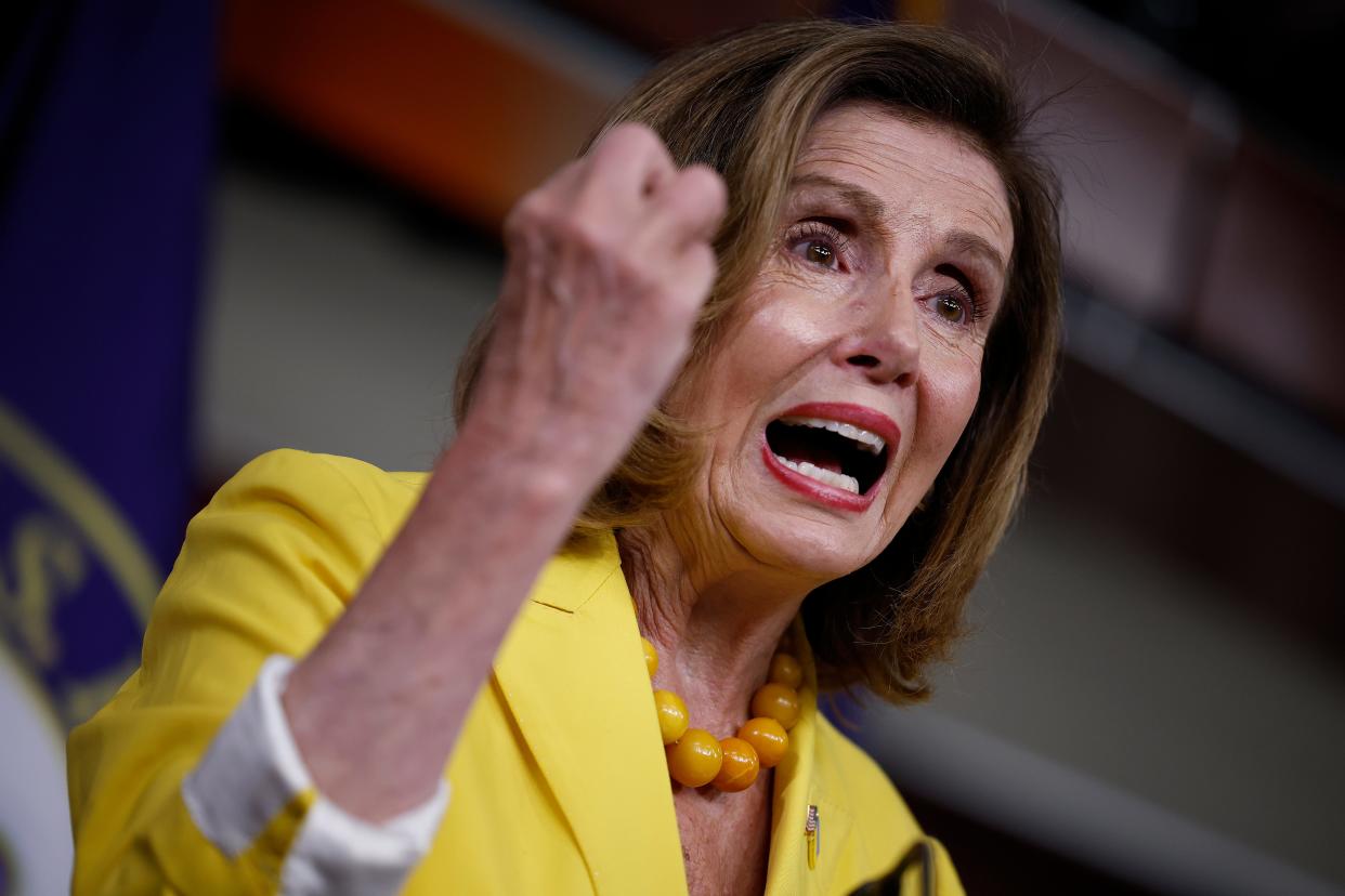 Nancy Pelosi shakes fist