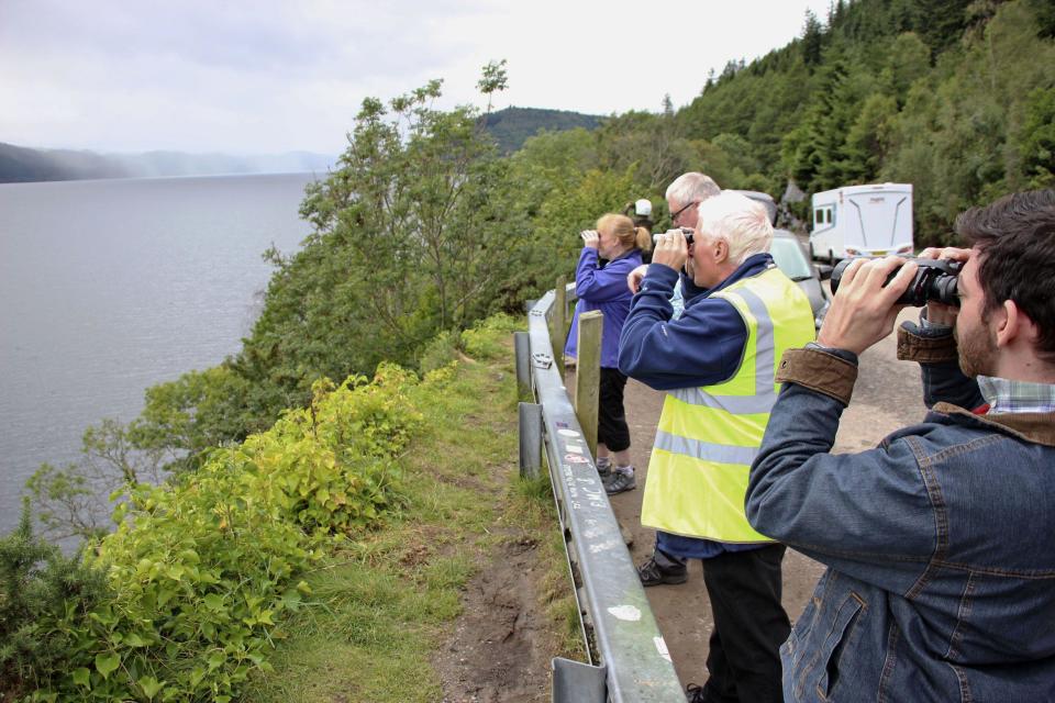 Volunteers watch the surface of Loch Ness in the Highlands of Scotland on Aug. 27, 2023, for signs of the legendary monster Nessie. Two groups undertook the biggest search for Nessie in 50 years on Aug. 26 and Aug. 27, with around 100 volunteers taking part each day. (Kyodo)==Kyodo Photo via Credit: Newscom/Alamy Live News