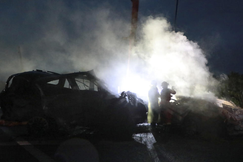 In this photo released by Xinhua News Agency, rescuers work at the site of a highway section that collapsed on the Meizhou-Dabu Expressway in Meizhou, south China's Guangdong Province on Wednesday, May 1, 2024. The death toll has climbed as search efforts continue in southern China after a highway section collapsed in a mountainous area, sending more a dozen cars down a steep slope. (Wang Ruiping/Xinhua via AP)