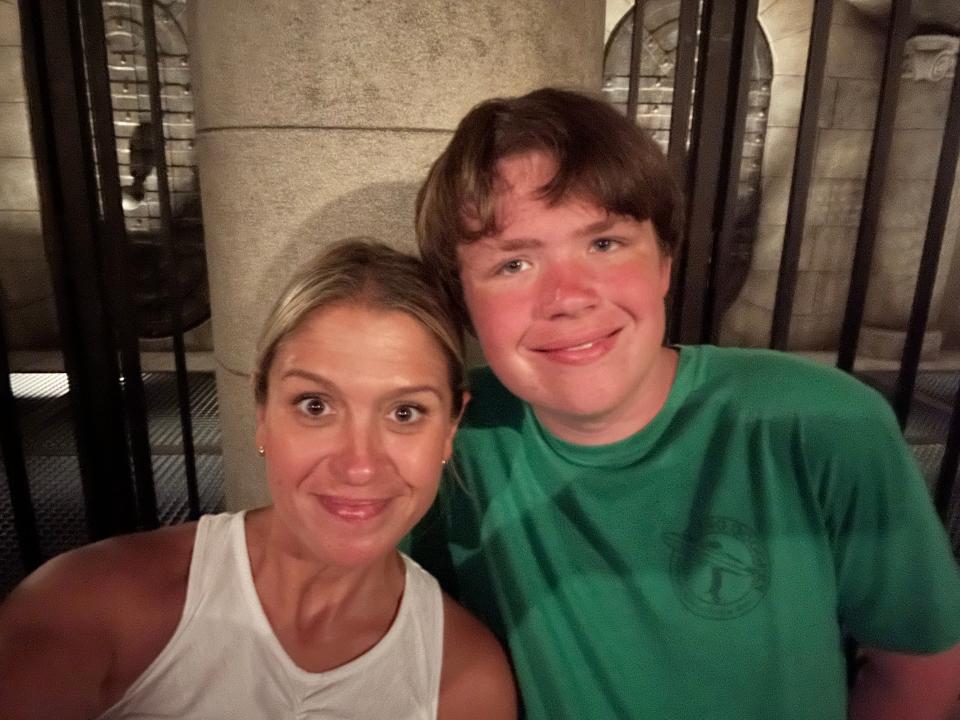 terri and her son waiting in line for a ride at universal orlando