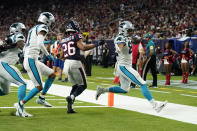 Carolina Panthers tight end Tommy Tremble (82) rushes for a touchdown as Houston Texans cornerback Vernon Hargreaves III (26) defends during the second half of an NFL football game Thursday, Sept. 23, 2021, in Houston. (AP Photo/Eric Christian Smith)