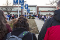 <p>Students and community members hold hands in prayer before classes at Paducah Tilghman High School in Paducah, Ky., Wednesday, Jan. 24, 2018. The gathering was held for the victims of the Marshall County High School shooting on Tuesday. (Photo: Ryan Hermens/The Paducah Sun via AP) </p>
